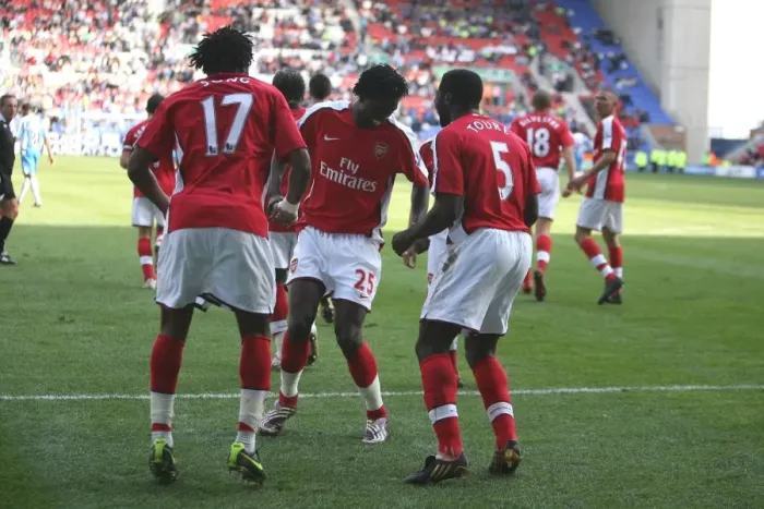 Framed Print : Fourth Goal Celebration: Alex Song, Emmanuel Adebayor, and Kolo Toure, Arsenal's Winning Moment against Wigan Athletic in the Premier League Framed Print : Fourth Goal Celebration: Alex Song, Emmanuel Adebayor, and Kolo Toure, Arsenal's Winning Moment against Wigan Athletic in the Premier League