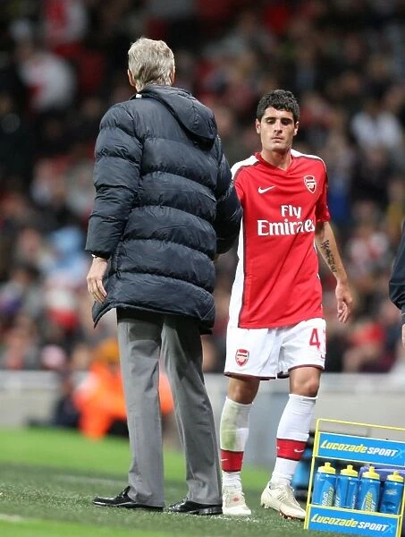 Fran Merida (Arsenal) shakes hands with Arsene Wenger the Arsenal Manager