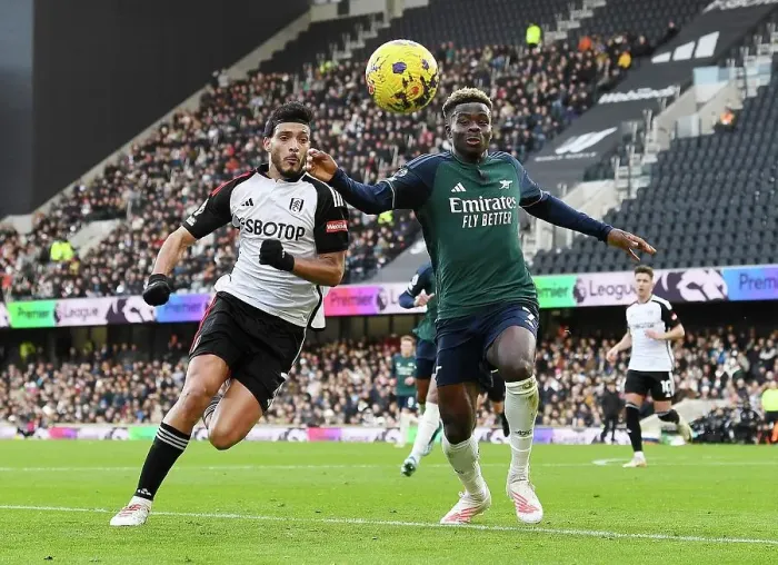 Framed Print : Fulham vs. Arsenal: A Fight for Control in the 2023-24 Premier League - Raul Jimenez vs. Bukayo Saka's Battle for Possession