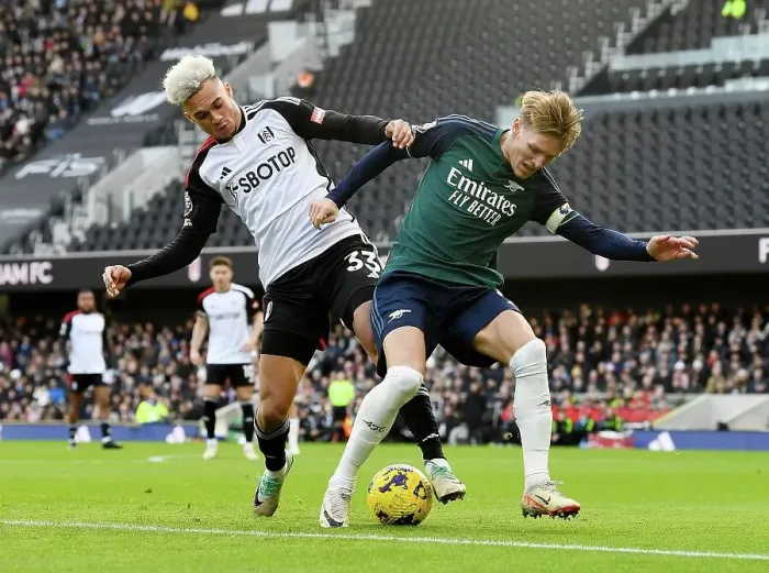 Framed Print : Fulham vs. Arsenal: Martin Odegaard Faces Off Against Antonee Robinson in Premier League Clash (December 2023)