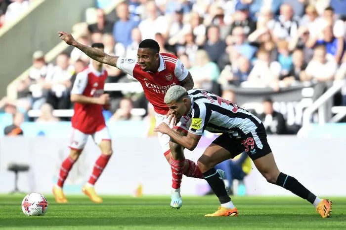 Framed Print : Gabriel Jesus vs Bruno Guimaraes: Intense Battle in Newcastle United vs Arsenal FC Premier League Clash
