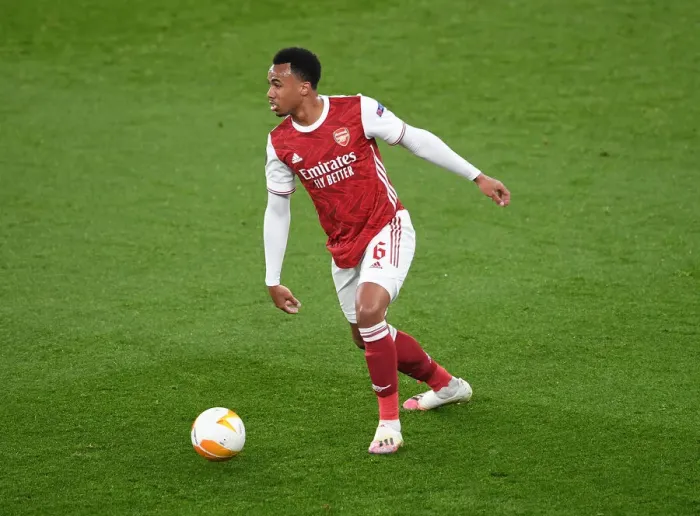 Framed Print : Gabriel Magalhaes: Arsenal's Unyielding Defender in Empty Emirates Stadium during Europa League Clash against Olympiacos Framed Print : Gabriel Magalhaes: Arsenal's Unyielding Defender in Empty Emirates Stadium during Europa League Clash against Olympiacos