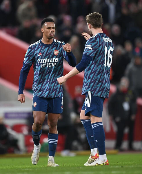 Gabriel Magalhaes and Rob Holding of Arsenal: Carabao Cup Semi-Final First Leg Showdown at Anfield