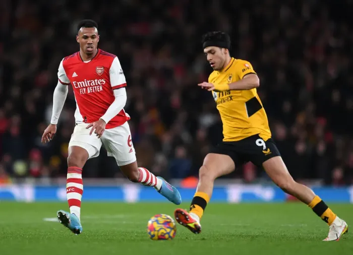 Framed Print : Gabriel Magalhaes vs. Raul Jimenez: Intense Battle in Arsenal vs. Wolverhampton Wanderers Clash