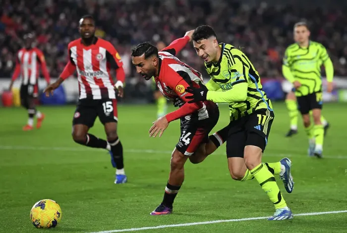 Framed Print : Gabriel Martinelli Pressures Saman Ghoddos: Brentford vs Arsenal, Premier League 2023-24