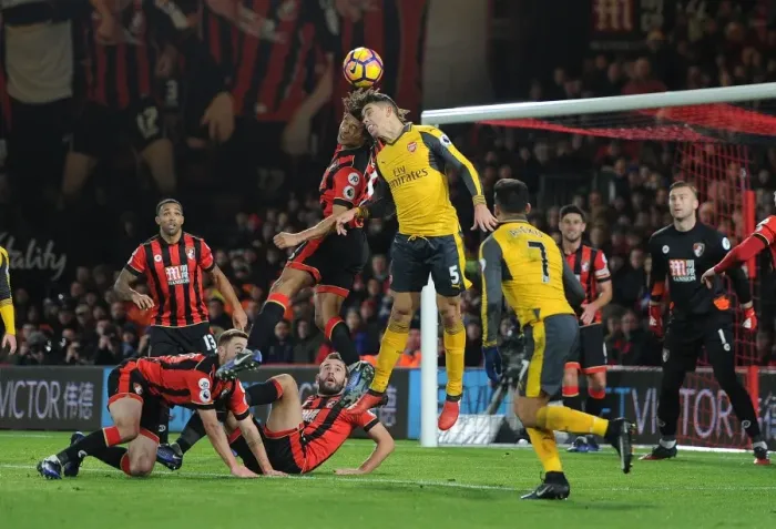 Framed Print : Gabriel vs. Ake: Intense Battle in AFC Bournemouth vs. Arsenal Premier League Clash