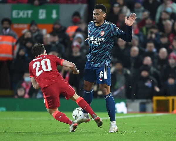Gabriel vs. Diogo Jota: A Tense Battle in the Carabao Cup Semi-Final Between Liverpool and Arsenal