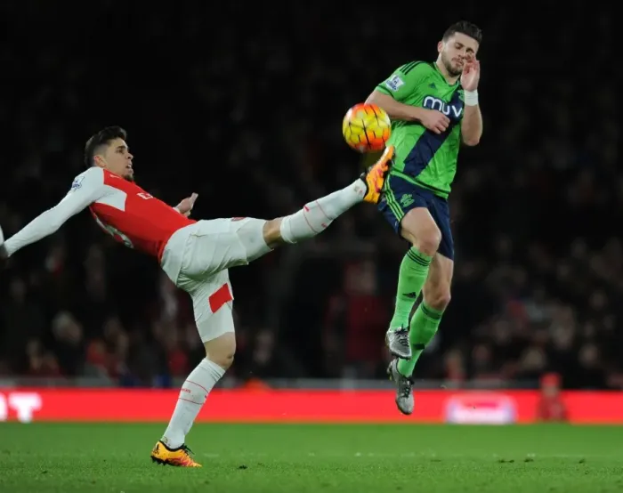 Framed Print : Gabriel vs. Long: A Premier League Showdown at Emirates Stadium