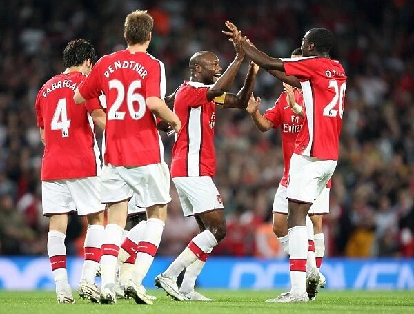 Gallas and Teammates Celebrate Arsenal's Second Goal in 4-0 UEFA Champions League Victory