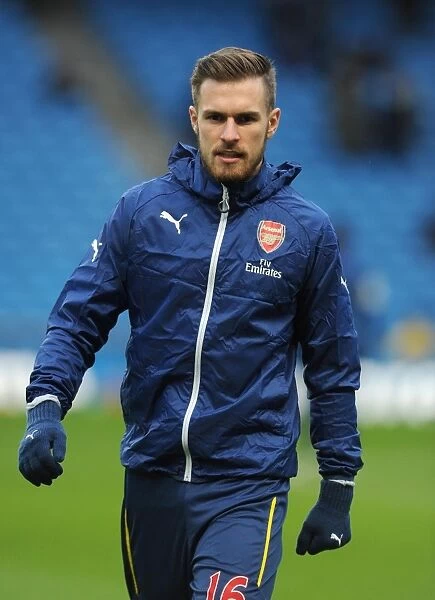 Gearing Up for the Big Battle: Aaron Ramsey's Focused Warm-Up (Manchester City vs Arsenal, Premier League 2014-15)