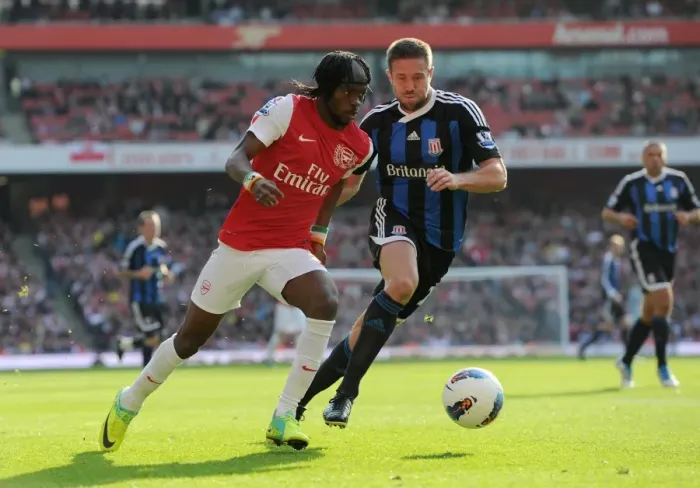 Framed Print : Gervinho (Arsenal) Matthew Upson (Stoke). Arsenal 3: 1 Stoke City. Barclays Premier League