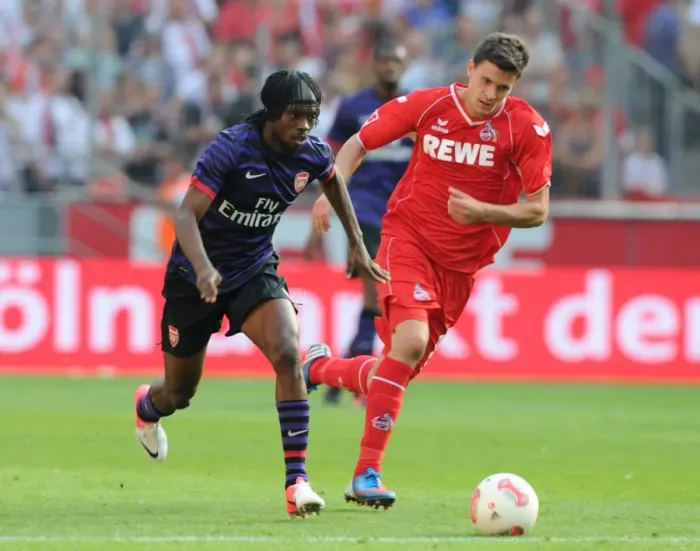 Framed Print : Gervinho (Arsenal) Tobias Strobl (Cologne). Cologne 0: 4 Arsenal. Pre Season Friendly