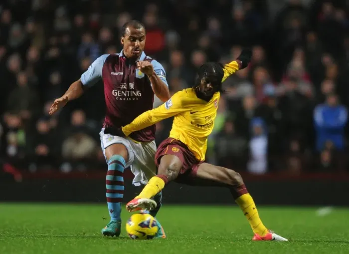 Framed Print : Gervinho vs Agbonlahor: Intense Battle in Aston Villa vs Arsenal Premier League Clash