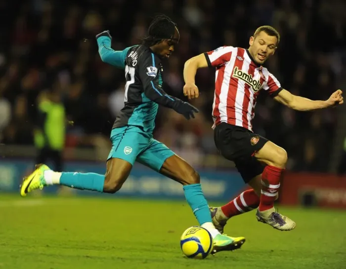 Framed Print : Gervinho vs. Bardsley: Intense Battle in Sunderland v Arsenal FA Cup Clash Framed Print : Gervinho vs. Bardsley: Intense Battle in Sunderland v Arsenal FA Cup Clash