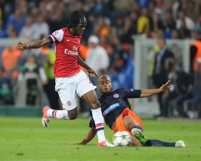 Framed Print : Gervinho vs. Bocaly: Montpellier vs. Arsenal, UEFA Champions League, 2012-13