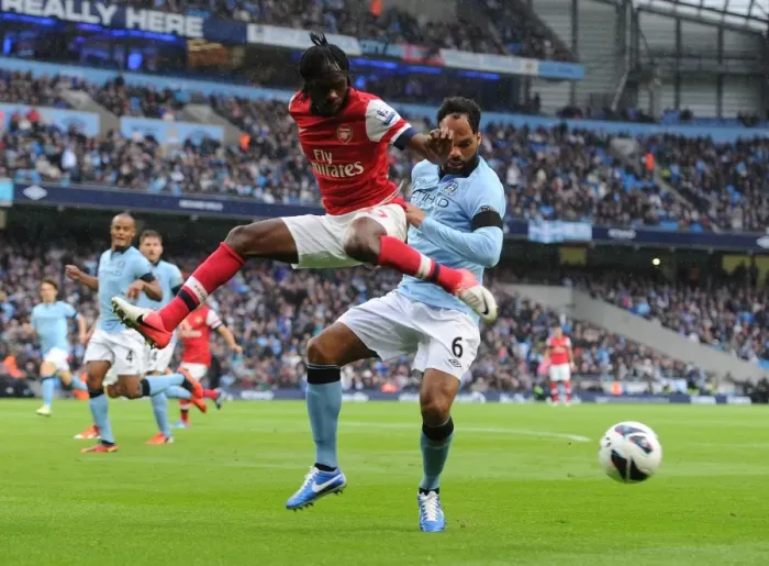 Framed Print : Gervinho vs. Joleon Lescott: Manchester City vs. Arsenal, Premier League Showdown (2012)