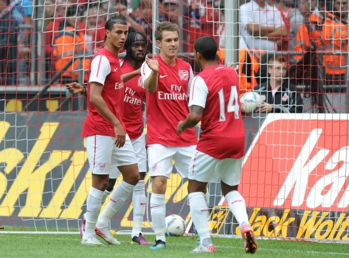 Framed Print : Gervinho's Brace: Arsenal Celebrates Double Delight Against Cologne