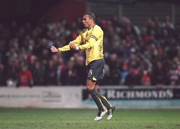 Gilberto celebrates scoring for Arsenal during the penalty shoot out