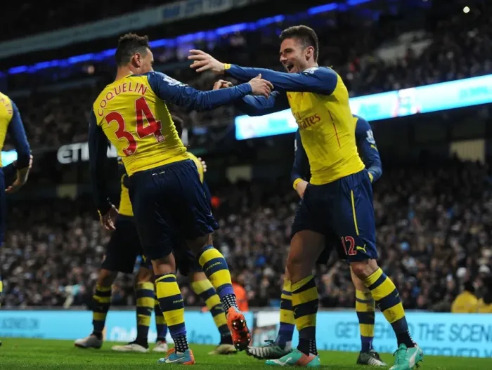 Framed Print : Giroud and Coquelin's Euphoric Goal Celebration: Arsenal's Victory Moment Against Manchester City (2014-15)