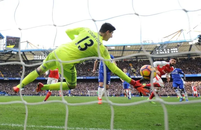 Framed Print : Giroud Stuns Chelsea: Olivier Scores Dramatic Goal Past Courtois in Premier League Clash