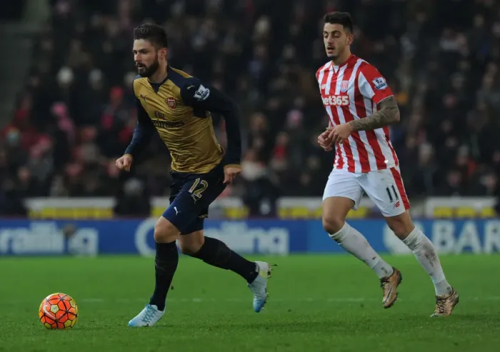 Framed Print : Giroud Surges Past Joselu: Stoke City vs. Arsenal, Premier League 2015-16 Framed Print : Giroud Surges Past Joselu: Stoke City vs. Arsenal, Premier League 2015-16