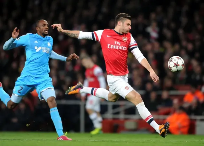 Framed Print : Giroud vs Abdallah: Intense Moment at Arsenal v Marseille, UEFA Champions League Framed Print : Giroud vs Abdallah: Intense Moment at Arsenal v Marseille, UEFA Champions League