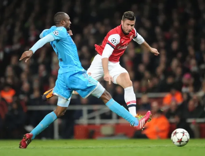 Framed Print : Giroud vs Abdallah: Intense Moment at Arsenal vs Marseille, UEFA Champions League (2013) Framed Print : Giroud vs Abdallah: Intense Moment at Arsenal vs Marseille, UEFA Champions League (2013)
