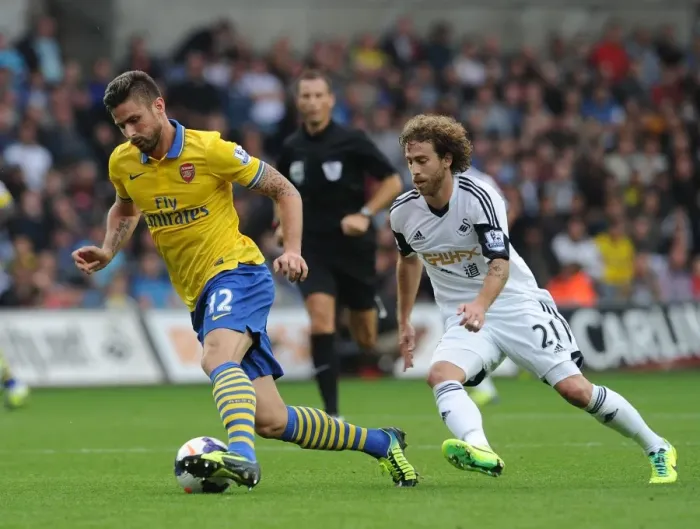 Framed Print : Giroud vs Canas: A Premier League Battle at Swansea, 2013-14 Framed Print : Giroud vs Canas: A Premier League Battle at Swansea, 2013-14