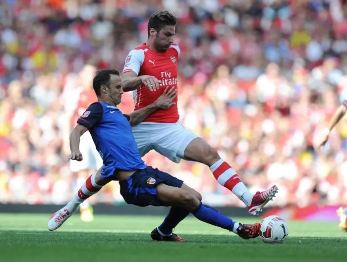 Framed Print : Giroud vs. Carvalho: Intense Battle at the Emirates Cup
