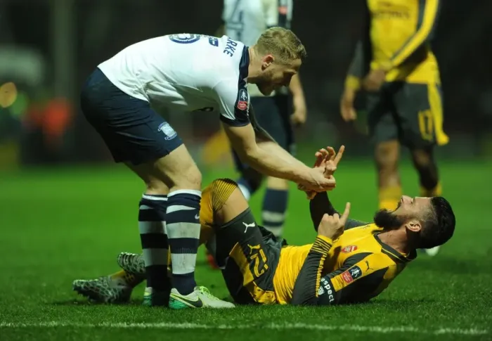 Framed Print : Giroud vs Clarke: Tangled Battle - Arsenal's FA Cup Clash at Preston North End Framed Print : Giroud vs Clarke: Tangled Battle - Arsenal's FA Cup Clash at Preston North End