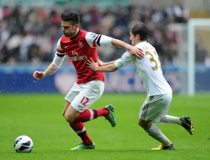 Framed Print : Giroud vs. Davies: Intense Battle at Swansea's Liberty Stadium - Arsenal vs. Swansea City, Premier League 2012-2013 Framed Print : Giroud vs. Davies: Intense Battle at Swansea's Liberty Stadium - Arsenal vs. Swansea City, Premier League 2012-2013