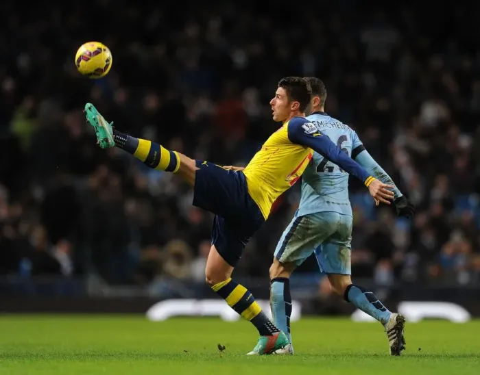 Framed Print : Giroud vs. Demichelis: Intense Battle at the Etihad - Manchester City vs. Arsenal, Premier League 2014-15