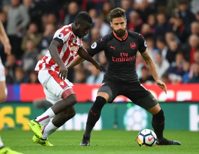 Framed Print : Giroud vs Diouf: Intense Battle at Stoke City vs Arsenal, Premier League 2017-18 Framed Print : Giroud vs Diouf: Intense Battle at Stoke City vs Arsenal, Premier League 2017-18