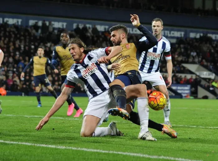 Framed Print : Giroud vs Evans: A Premier League Tackle Battle at The Hawthorns Framed Print : Giroud vs Evans: A Premier League Tackle Battle at The Hawthorns