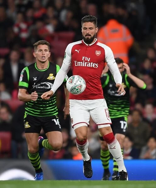 Giroud vs. Houghton: A Carabao Cup Battle - Arsenal Forward Clashes with Doncaster Midfielder