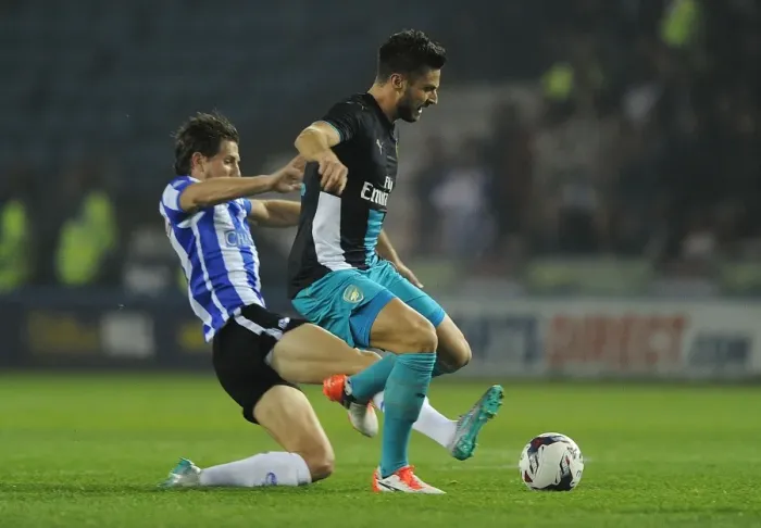 Framed Print : Giroud vs Hutchinson: A Fierce Rivalry in the Capital One Cup - Arsenal vs Sheffield Wednesday (2015-16)