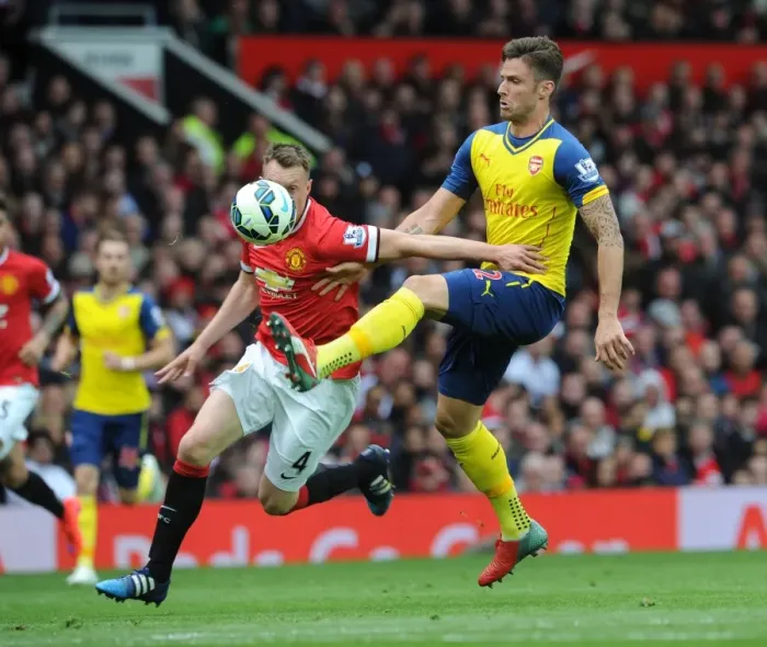Framed Print : Giroud vs Jones: A Premier League Showdown at Old Trafford, 2014-15 Framed Print : Giroud vs Jones: A Premier League Showdown at Old Trafford, 2014-15