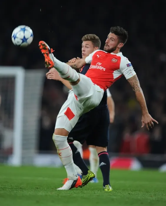 Framed Print : Giroud vs. Kimmich: Intense Battle in Arsenal FC vs. FC Bayern Munich UEFA Champions League Clash