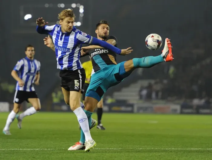 Framed Print : Giroud vs Loovens: A Battle in the Capital One Cup - Sheffield Wednesday vs Arsenal