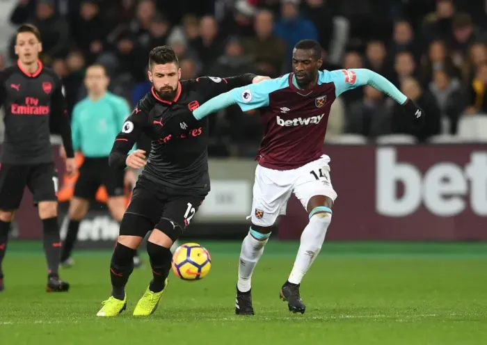 Framed Print : Giroud vs Obiang: A Willful Clash in the Premier League Showdown between Arsenal and West Ham