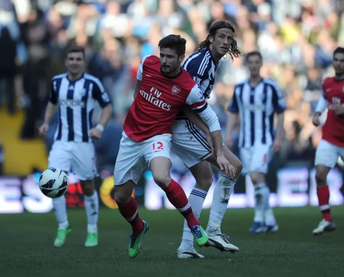 Framed Print : Giroud vs. Olsson: Intense Tussle in West Bromwich Albion vs. Arsenal Premier League Clash Framed Print : Giroud vs. Olsson: Intense Tussle in West Bromwich Albion vs. Arsenal Premier League Clash