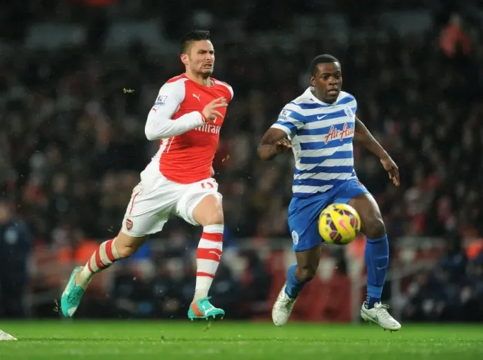 Framed Print : Giroud vs. Onuoha: Intense Battle at the Emirates - Arsenal v Queens Park Rangers, Premier League 2014-15