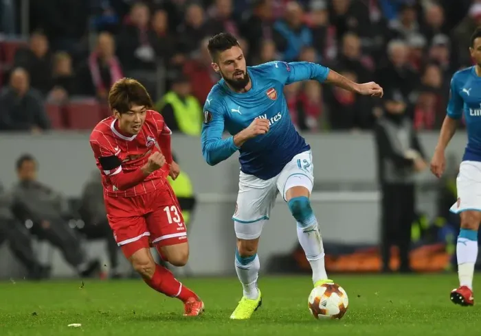 Framed Print : Giroud vs. Osako: Intense Battle in FC Koln vs. Arsenal UEFA Europa League Clash Framed Print : Giroud vs. Osako: Intense Battle in FC Koln vs. Arsenal UEFA Europa League Clash