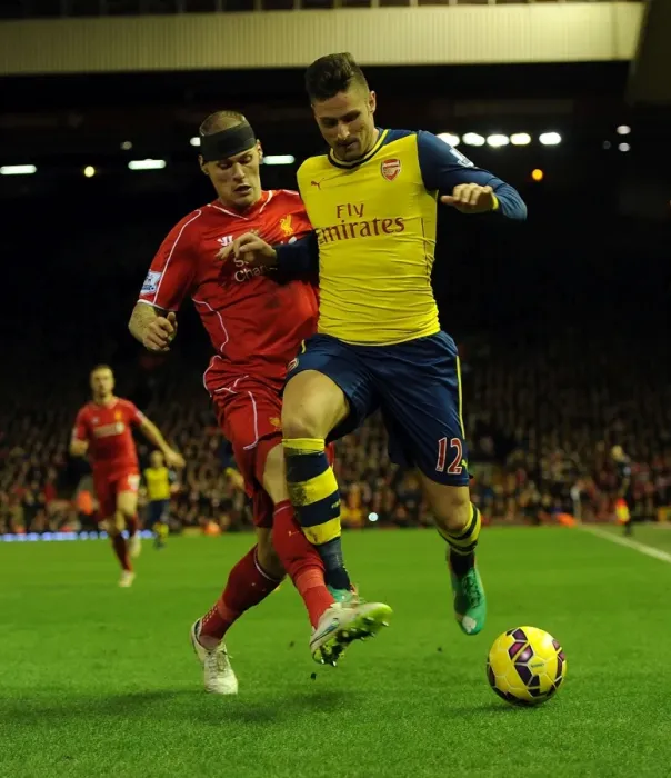 Framed Print : Giroud vs. Skrtel: A Football Rivalry Unfolds at Anfield