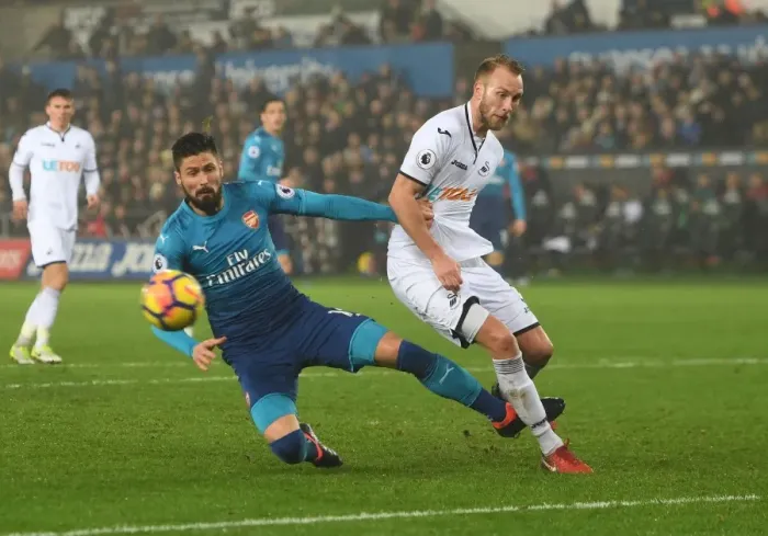 Framed Print : Giroud vs van der Hoorn: Intense Clash in Swansea City vs Arsenal Premier League Match Framed Print : Giroud vs van der Hoorn: Intense Clash in Swansea City vs Arsenal Premier League Match