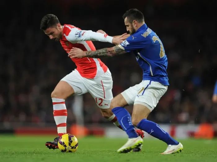 Framed Print : Giroud vs Wasilewski: A Premier League Showdown at Emirates Stadium - Arsenal vs Leicester City