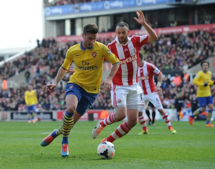 Framed Print : Giroud vs. Wilson: Intense Battle at Britannia Stadium - Stoke City vs. Arsenal, Premier League 2013-14
