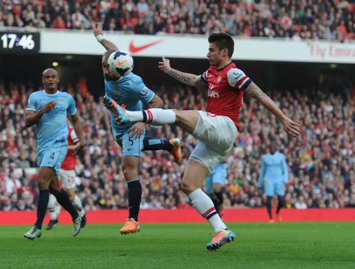 Framed Print : Giroud vs. Zabaleta: A Premier League Battle at the Emirates