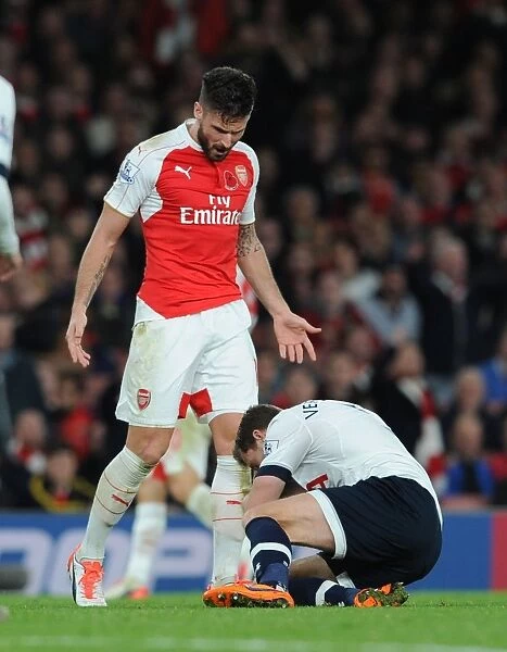 Giroud's Dominance: Arsenal Star Stands Over Vertonghen in Intense Arsenal vs. Tottenham Clash