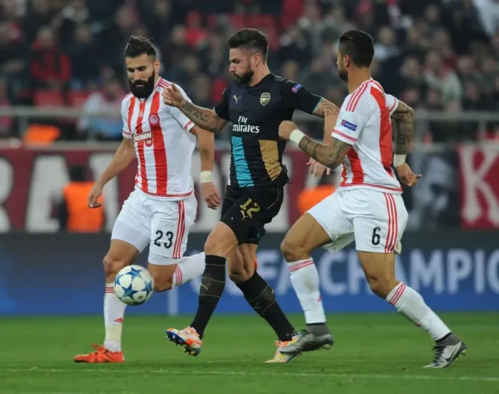 Framed Print : Giroud's Intense Battle with Siovas and da Costa: Olympiacos vs. Arsenal UEFA Champions League Clash Framed Print : Giroud's Intense Battle with Siovas and da Costa: Olympiacos vs. Arsenal UEFA Champions League Clash